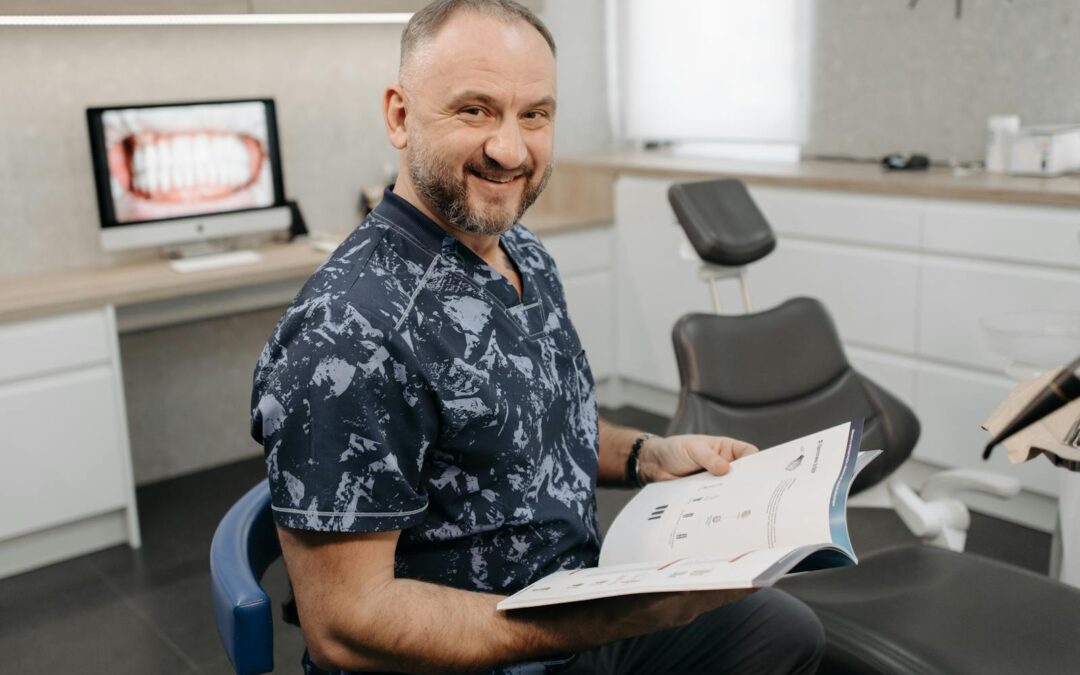 A Dentist Smiling and Holding a Book