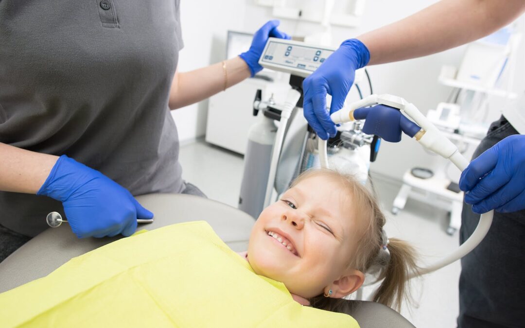 Girl Smiling on Dental Chair